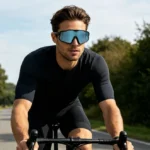 A CYCLIST WEARING AN ELECTROPHOTOCHROMIC GLASSES